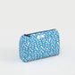 Blue and white wavy patterned pouch on a light gray background