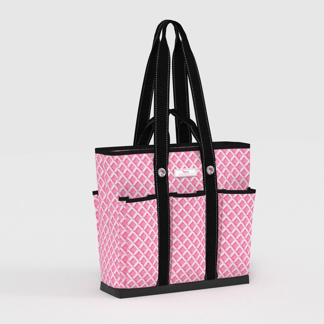 Pink patterned tote bag with black handles and trim on a light gray background