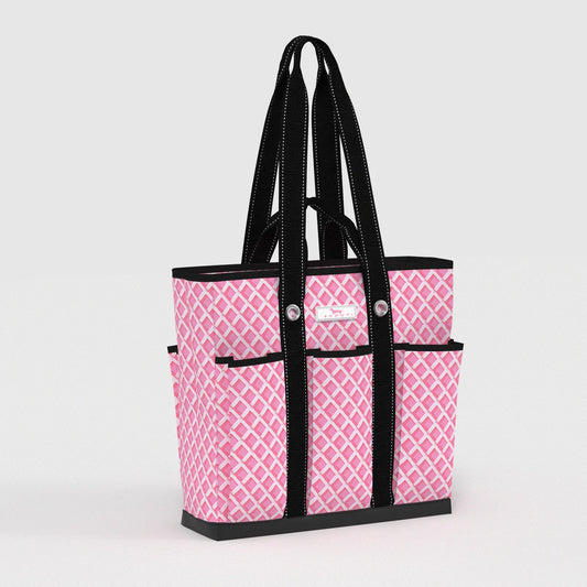 Pink patterned tote bag with black handles and trim on a light gray background