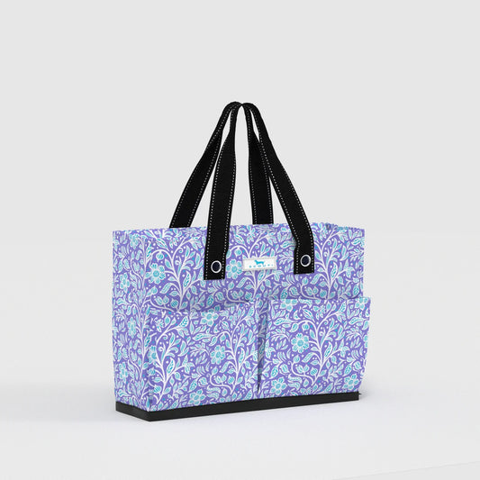 Purple floral-patterned tote bag with black handles on a light gray background