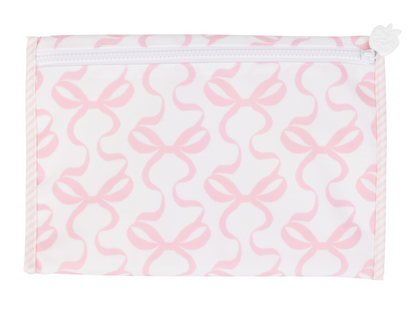 pink and white bow patterned changing pad on a white background