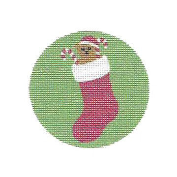 Circular green patch with a cartoonish sock character wearing a Santa hat on a white background