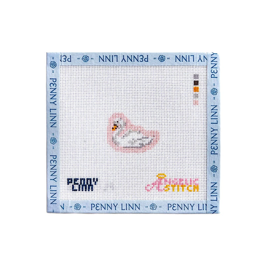 A Penny Linn cross-stitch canvas featuring a small stitched seal design in the center, surrounded by a light blue border printed with the brand name 'PENNY LINN'.