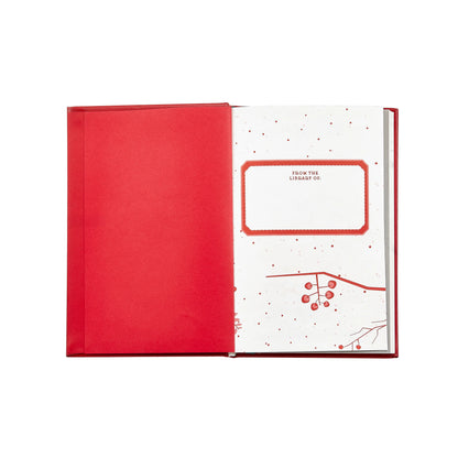 Red book with a white interior page featuring text and design on a white background