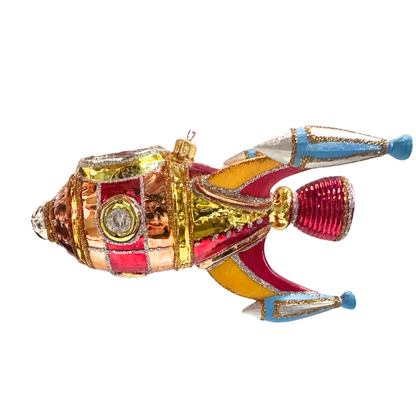 Colorful fish-shaped ornament with metallic finish on a white background