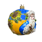 Decorative ornament with a character on a globe against a white background
