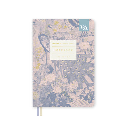 A notebook with a vintage peacock and floral pattern in muted blue, beige, and gold tones, featuring a white label on the front and a small blue tab in the top right corner.