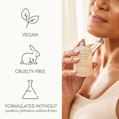 Woman holding a Thymes product with vegan, cruelty-free, and sulfate-free icons on the left.