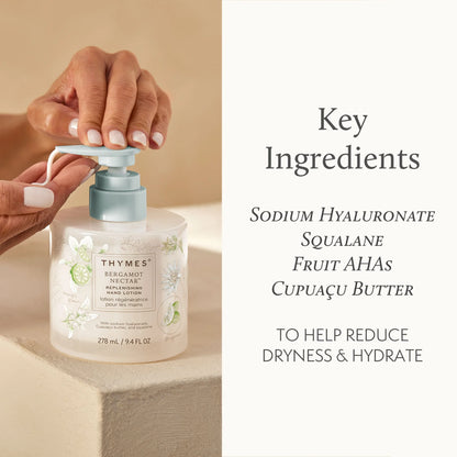 Hand holding a bottle of Thymes product with key ingredients listed on a beige background