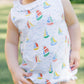 White one piece outfit with sailboat pattern