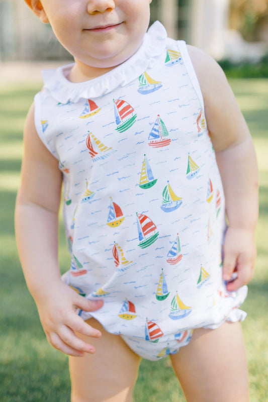 White one piece outfit with sailboat pattern