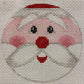 Cross-stitched design of a dog's face on fabric