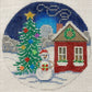 Decorative needlepoint of a snowy scene with a house, tree, and snowman.