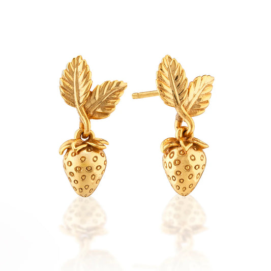 Gold strawberry-shaped earrings on a white background