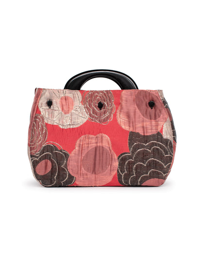 Small handbag with floral pattern on a white background
