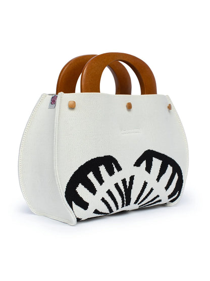 White handbag with zebra pattern and wooden handles on a white background