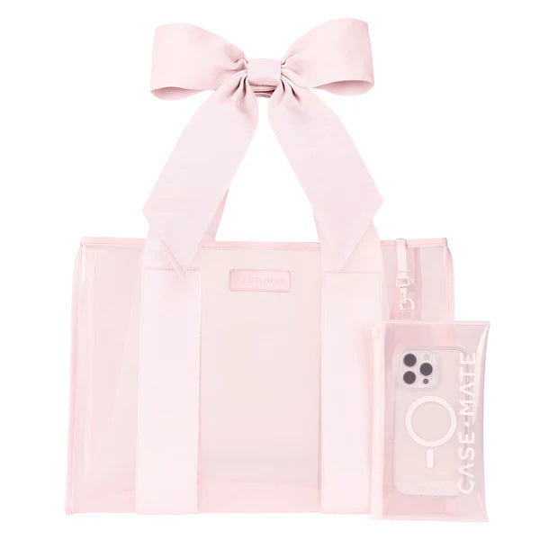 Pink tote bag with a bow and a phone case on a white background