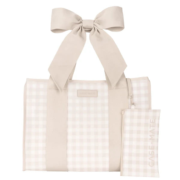 Beige tote bag with a large bow and matching pouch on a white background