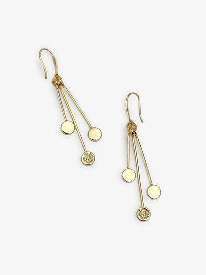 Gold earrings with dangling components on a white background
