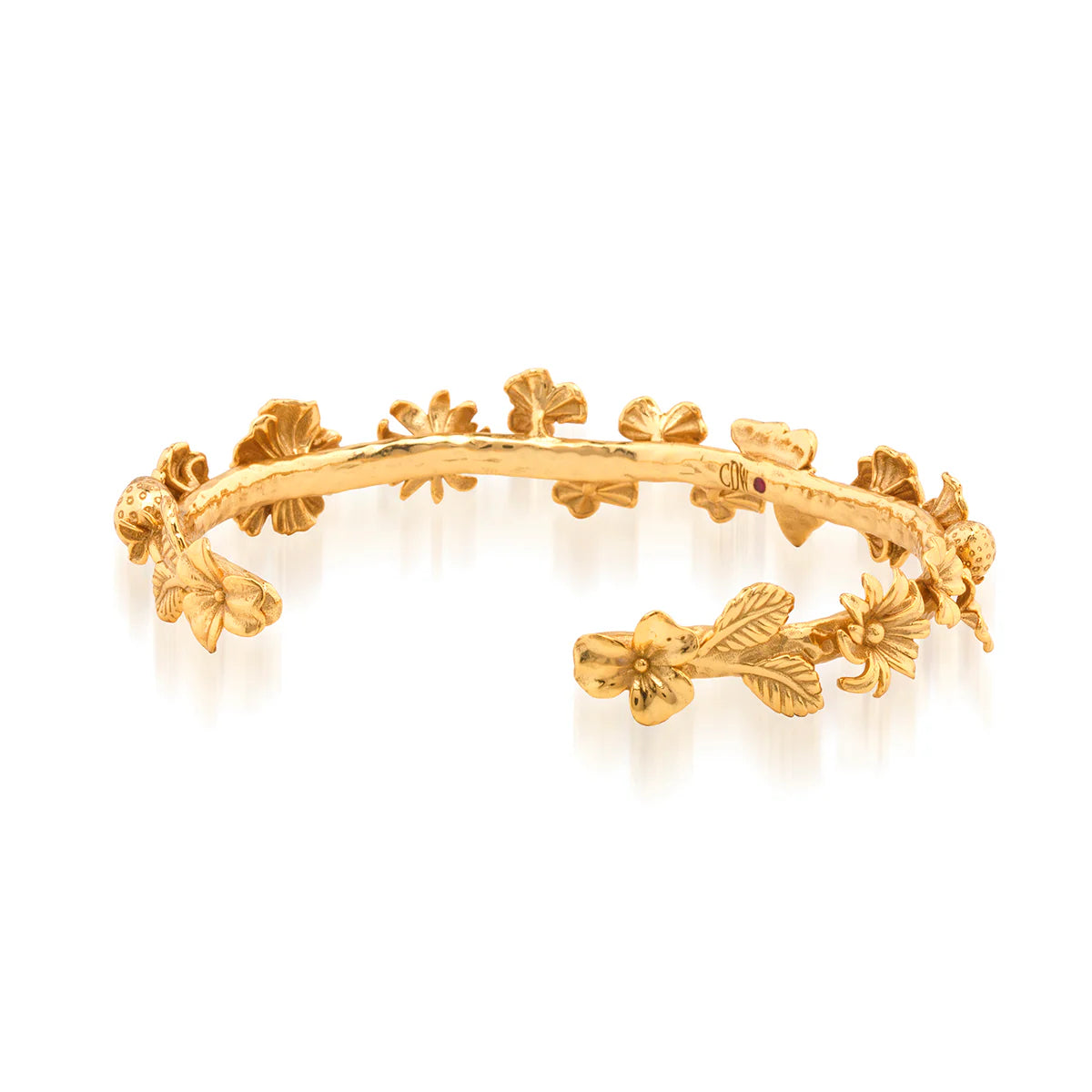 Gold bracelet with floral designs on a white background
