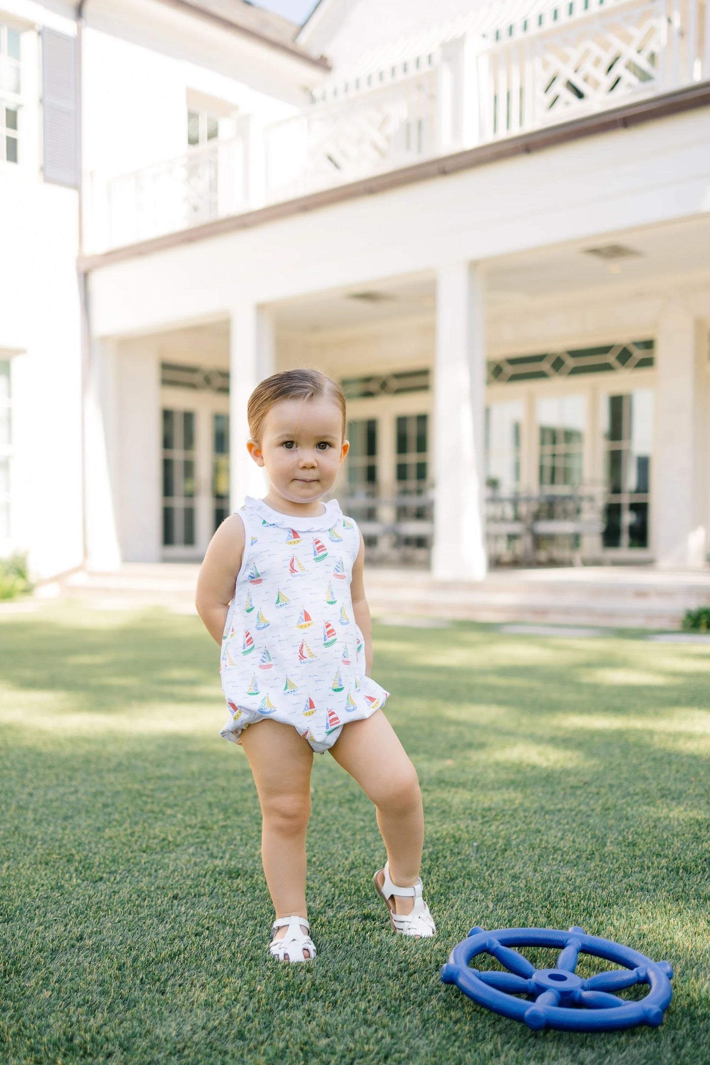 White one piece outfit with sailboat pattern