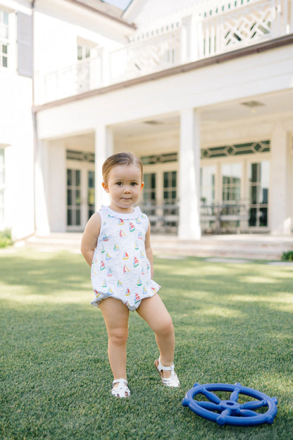 White one piece outfit with sailboat pattern