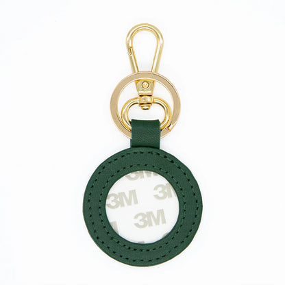 Green keychain with gold clasp on a white background