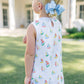 Child wearing a dress with sailboat pattern outdoors