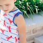Young girl wearing a dress with lobster print outdoors