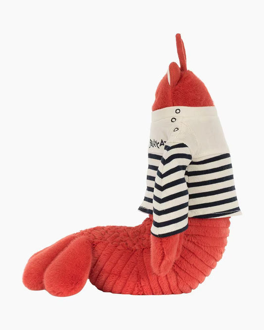 Plush toy lobster with a striped shirt on a white background