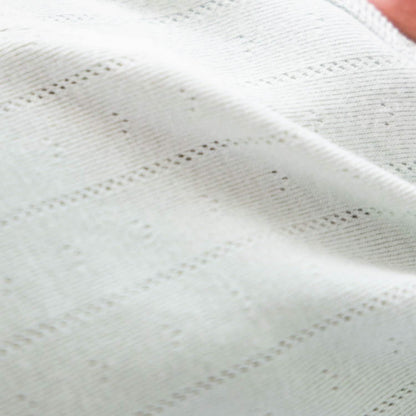 Close-up of a textured white fabric surface