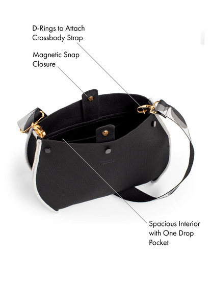 Black handbag with gold and silver accents on a white background