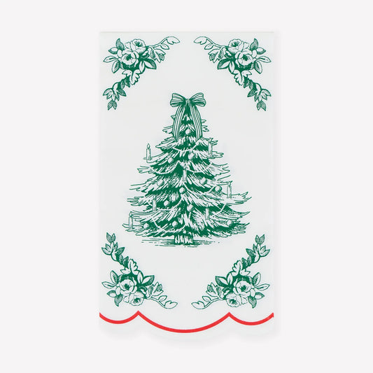 A white rectangular decorative panel or sign featuring a green illustrated Christmas tree in the center, floral corner motifs, and a red scalloped border along the bottom, shown against a light gray background.