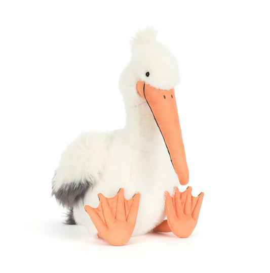 Stuffed toy pelican on a white background