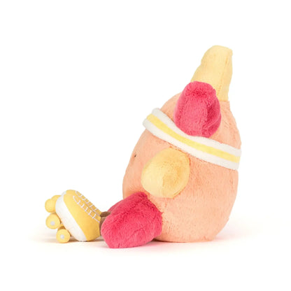 Plush toy resembling a banana with pink ends on a white background
