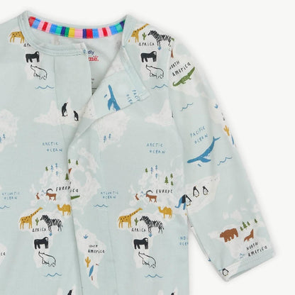 Children's outfit with world map and animal design on a light blue background