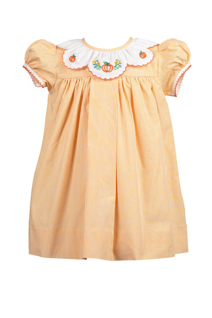 Yellow dress with floral embroidery on a white background