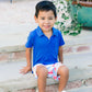 Blue short sleeve polo styled with blue and white shorts with red lobster pattern