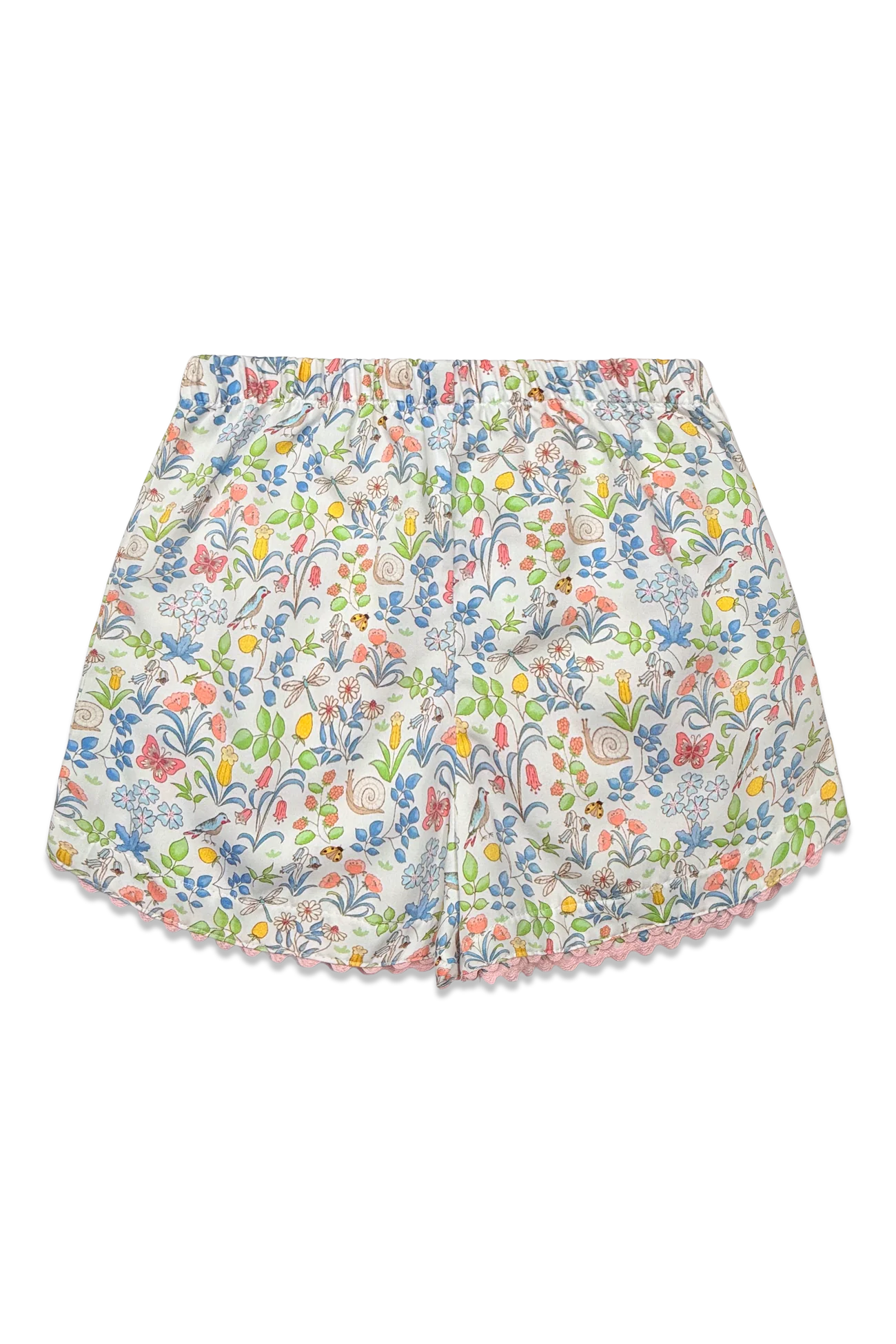 A pair of girl's shorts featuring an all-over multicolor floral print on a white base, finished with a delicate pink scalloped hem.