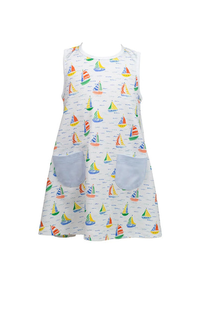 Dress with sailboat pattern and blue pockets on a white background